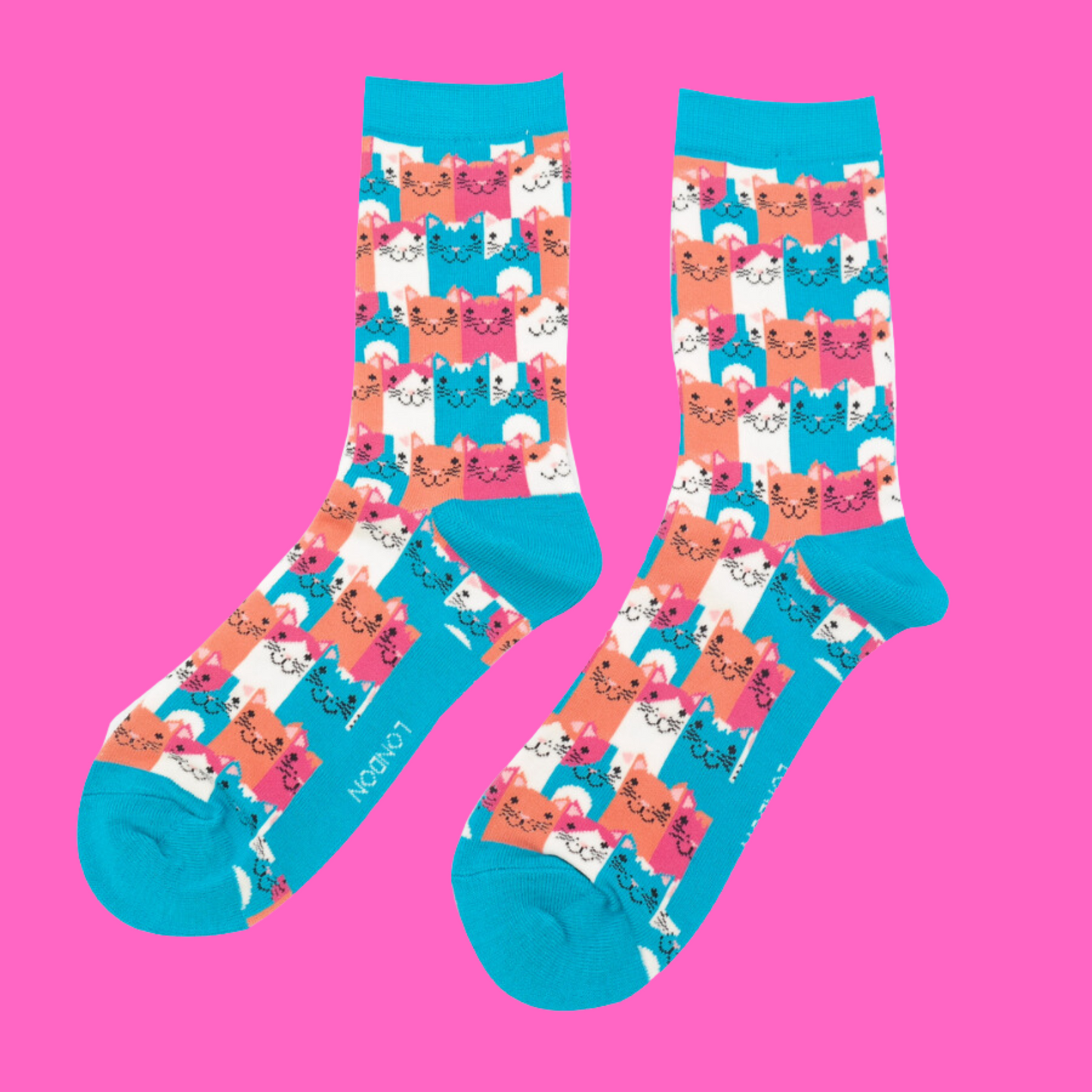 
                  
                    A pair of socks with a multicoloured happy anime cat pattern. Bright blue heel, toe and cuff.
                  
                