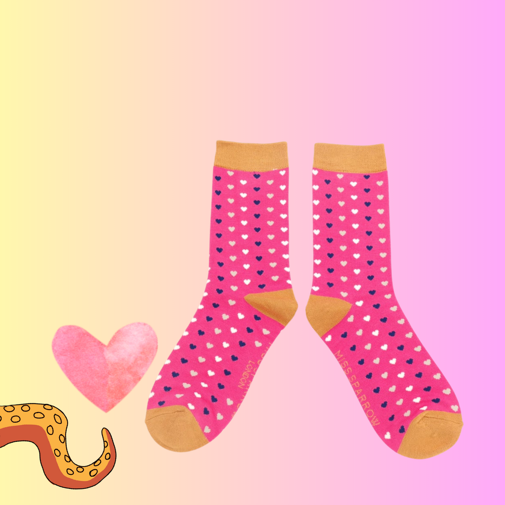 
                      
                        A pair of bamboo socks with a heart pattern Pink legs, orange toe, heel and cuff. 
                      
                    