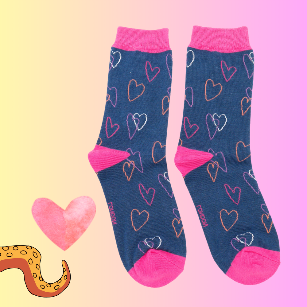 
                      
                        A pair of socks with a heart pattern. Blue legs, pink heel toe and cuff. 
                      
                    