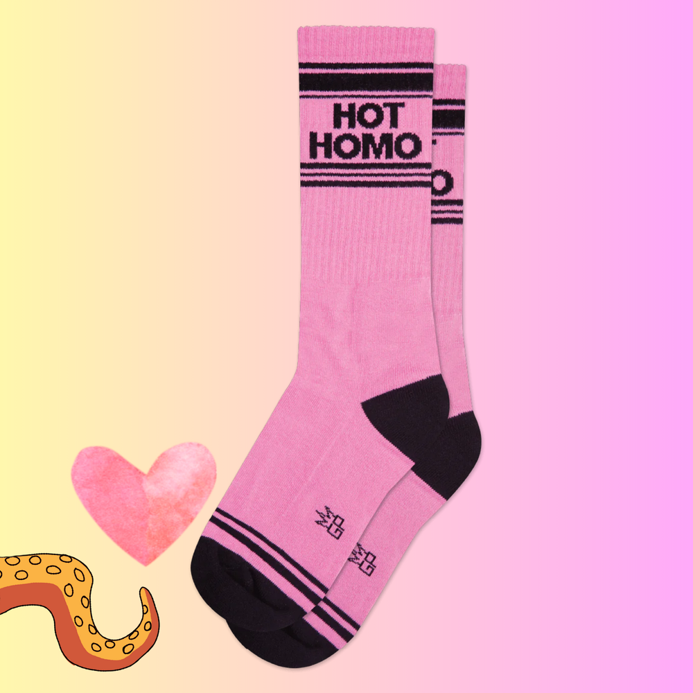 A bright pink pair of sports style socks with the slogan "Hot Homo". 