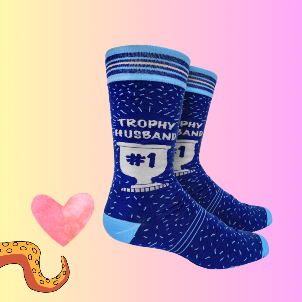 A pair of socks with a Trophy Husband motif. Blue legs, light blue toe, heel and cuff. 