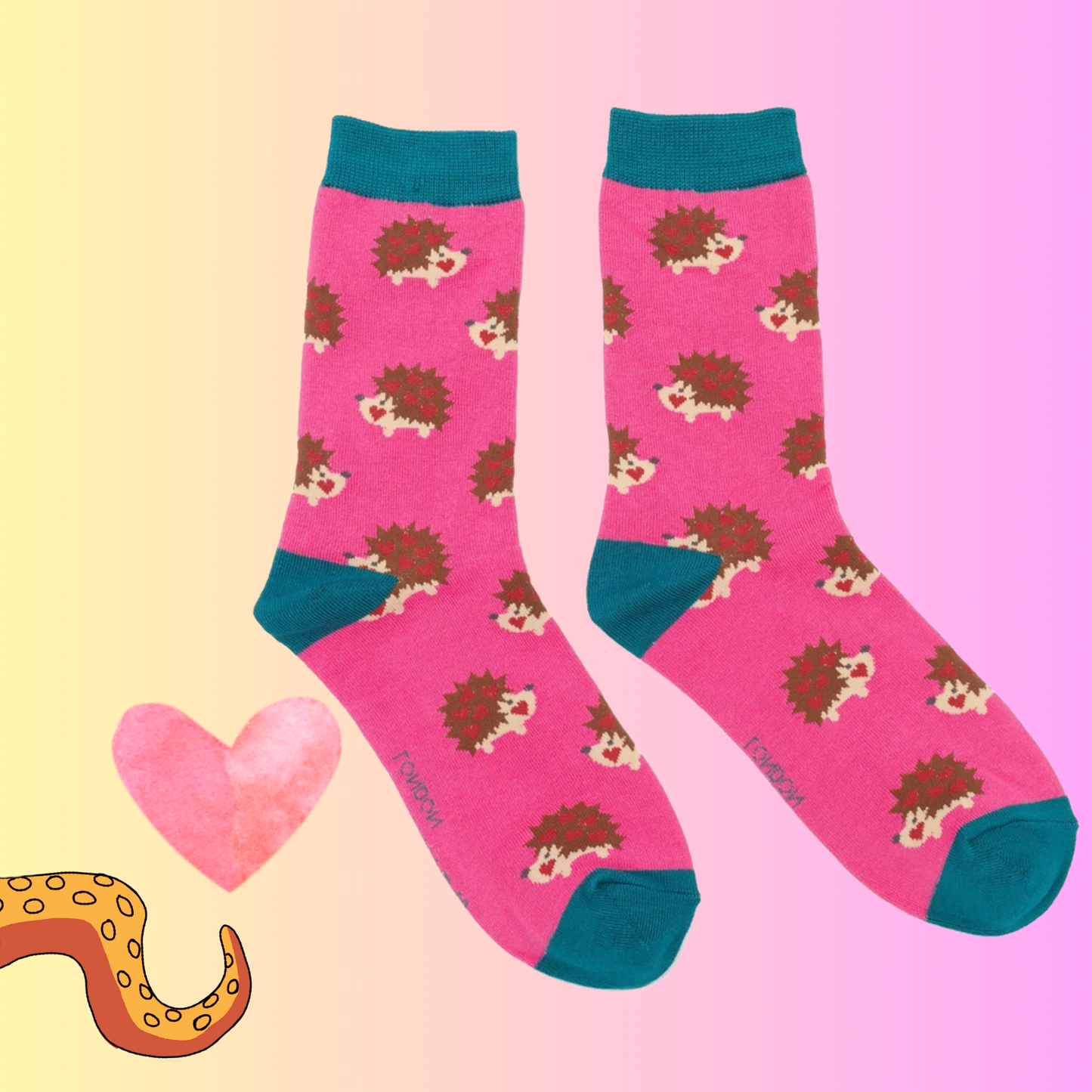 A pair of socks with a hedgehog motif. Hot pink legs, teal heel, toe and cuff. 