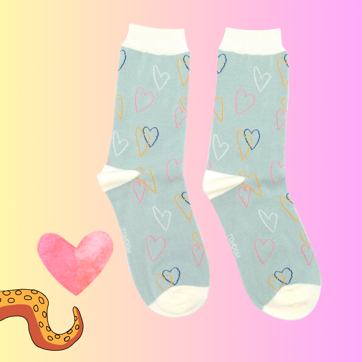 A pair of socks with a heart pattern. Grey legs, yellow heel, toe and cuff. 