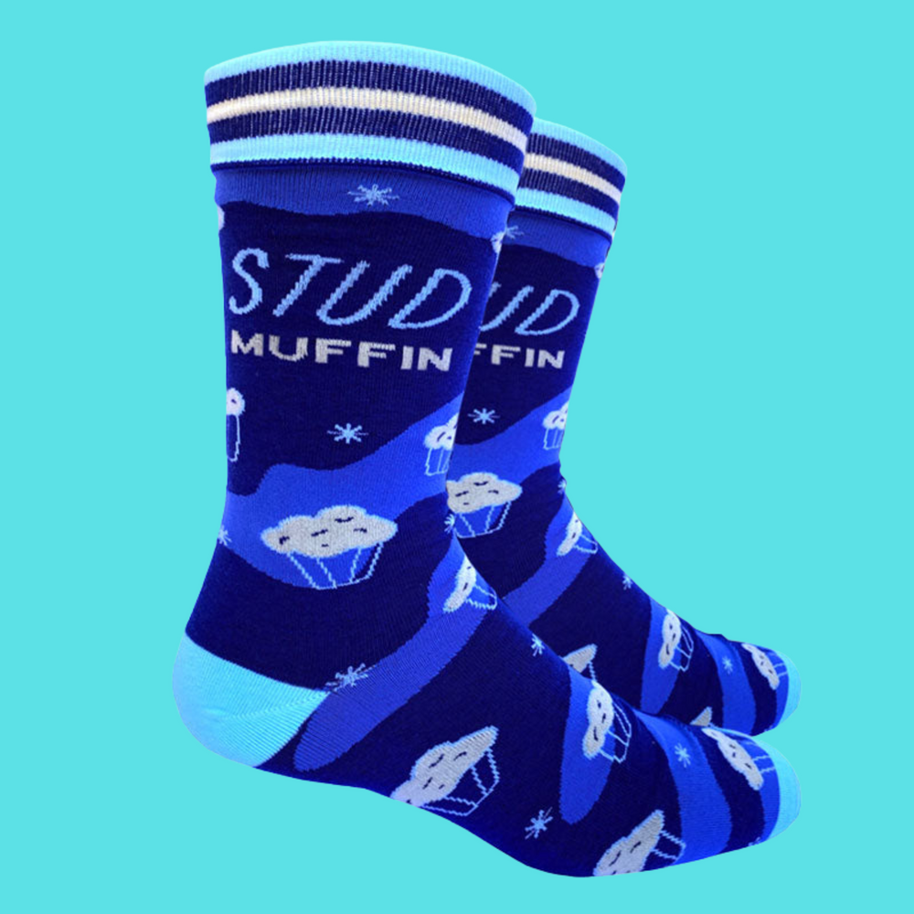 
                      
                        A pair of socks with a stud muffin slogan. Blue legs, light blue heel, toe and cuff. 
                      
                    