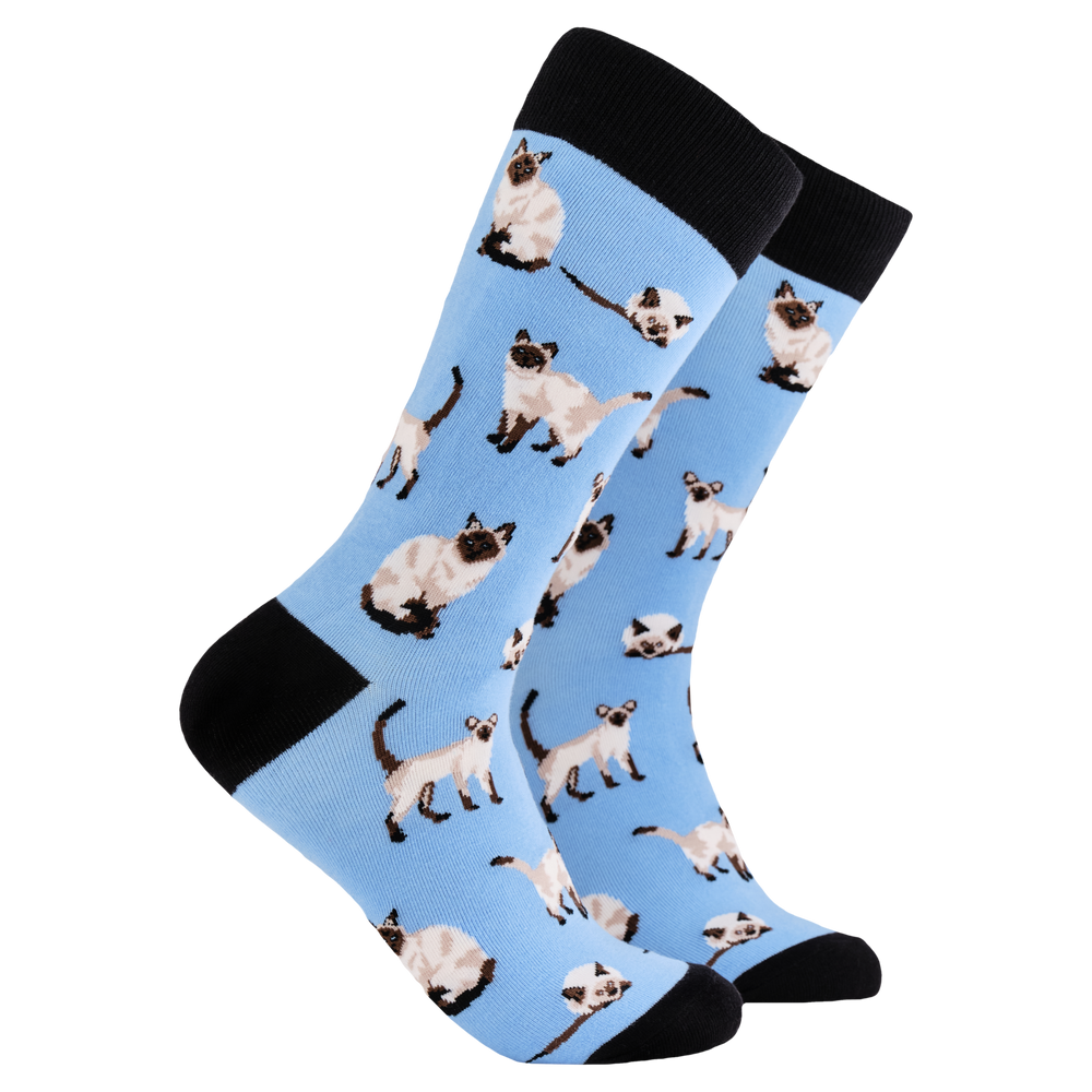 Siamese Cat Socks. A pair of socks depicting siamese cats. Blue legs, black cuff, heel and toe.