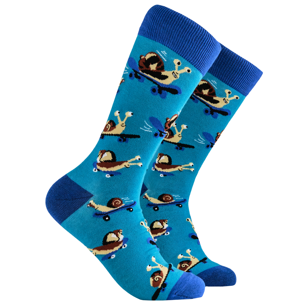 
                      
                        Snail Socks - Snail Boarder. A pair of socks depicting a snail on a skateboard. Blue legs, light blue heel, toe and cuff. 
                      
                    