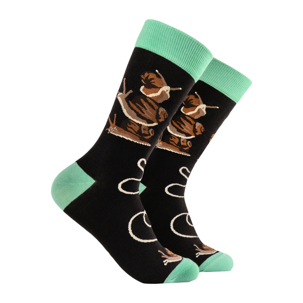 
                      
                        A pair of socks depicting snails. Black legs, green heel, toe and cuff. 
                      
                    