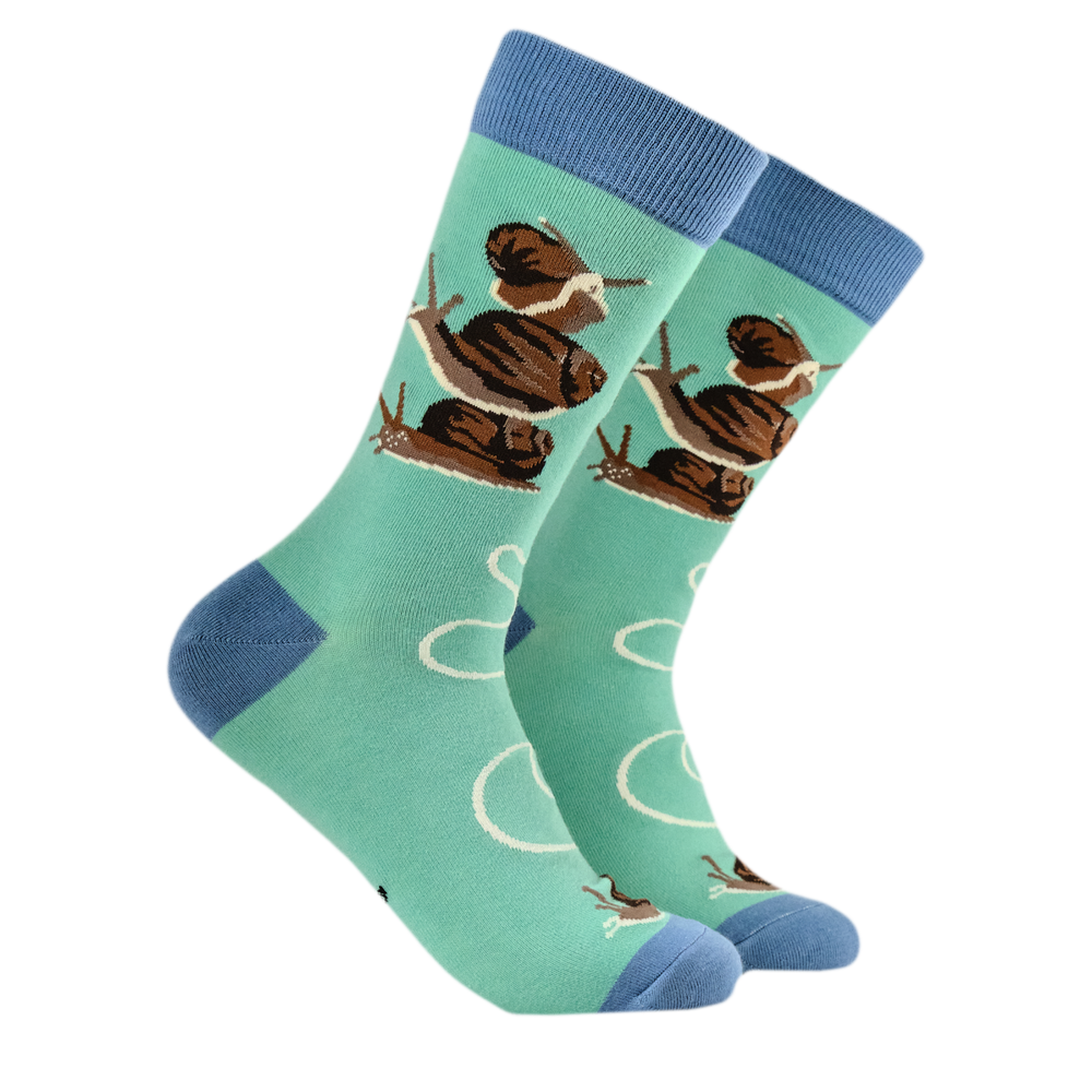 Snails Bamboo Socks. A pair of socks depicting snails. Turquoise legs, blue heel, toe and cuff. 