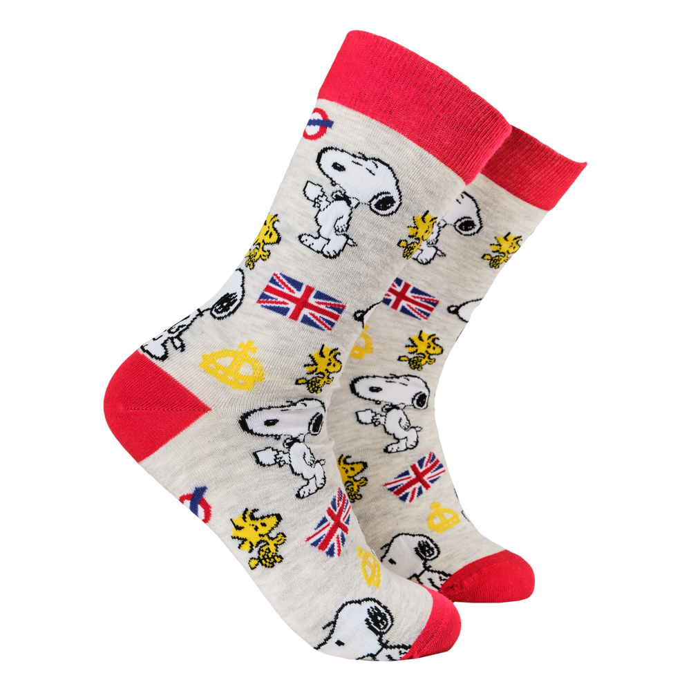 
                      
                        Peanuts Socks - Snoopy In London. A pair of socks depicting Snoopy and Woodstock with a London motif. Grey legs, red cuff, toe and heel. 
                      
                    