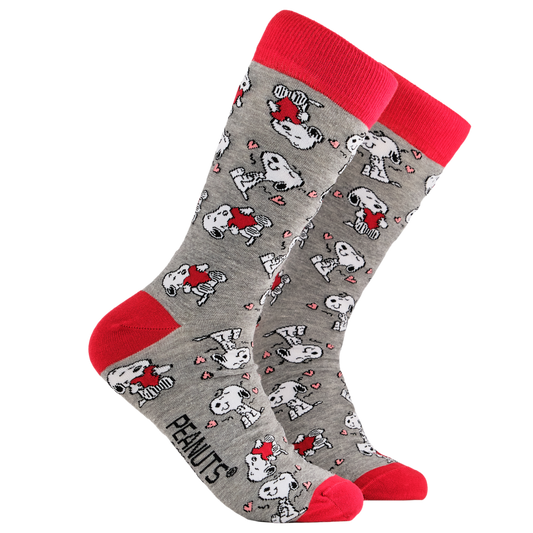 Peanuts Socks - Snoopy in Love. A pair of socks depicting Snoopy and love hearts. Grey legs, red cuff, heel and toe.