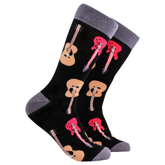 Guitar Socks - Strings Attached. A pair of socks depicting electric and acoustic guitars. Black legs, grey cuff, heel and toe.