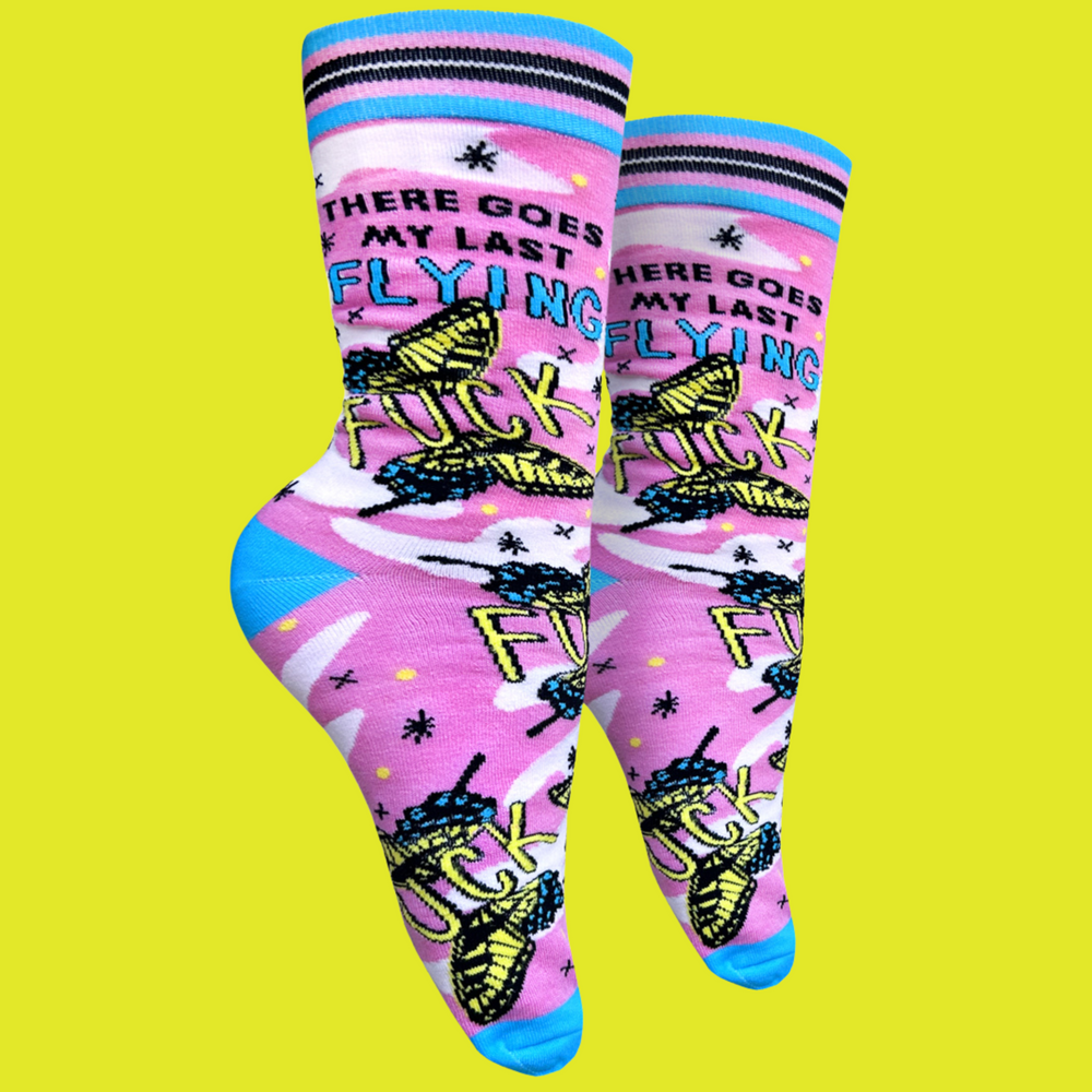 
                  
                    Last Flying F**k Socks - Small. A pair of socks with a bold slogan and a pink and yellow butterfly motif. Bright blue heel, toe and cuff.
                  
                