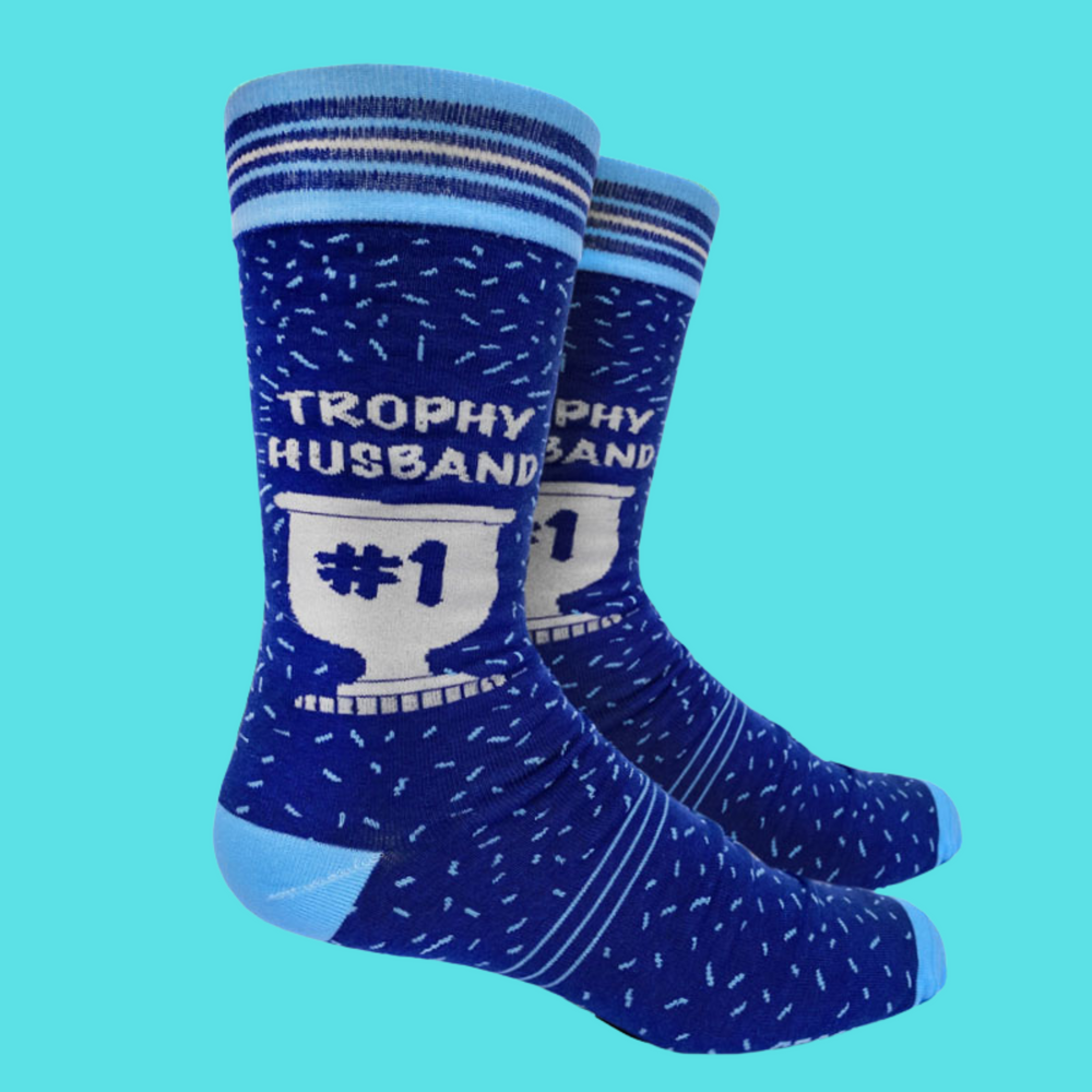 
                      
                        A pair of socks with a Trophy Husband motif. Blue legs, light blue toe, heel and cuff. 
                      
                    