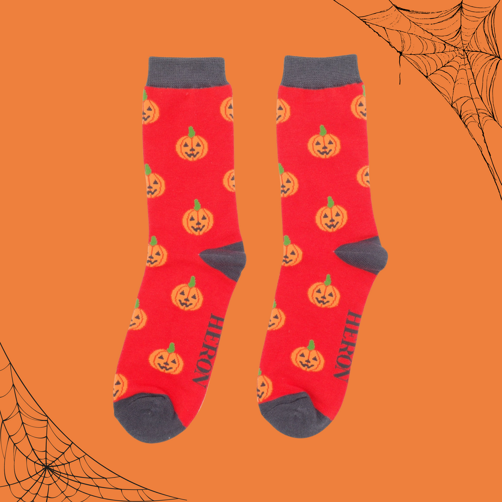 
                      
                        A pair of socks with a happy halloween pumpkin motif. 
                      
                    