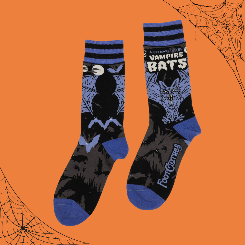 
                      
                        A pair of socks depicting a scary looking vampire bat. Blue toes, cuff and heel. 
                      
                    