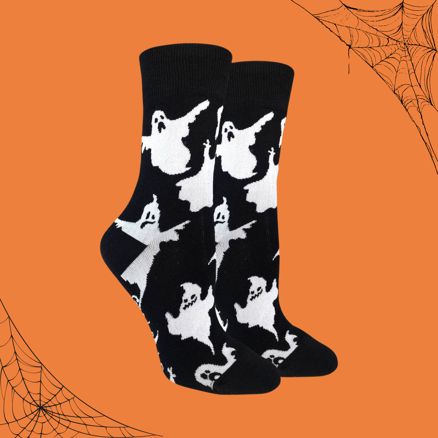 A pair of socks depicting classic bed sheet ghosts on a black background. 