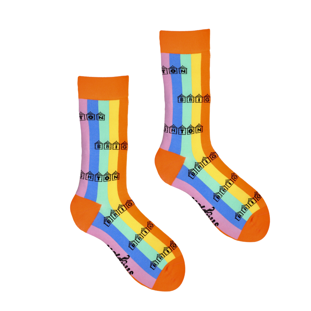 Rainbow striped socks with Brighton written inside beach huts.