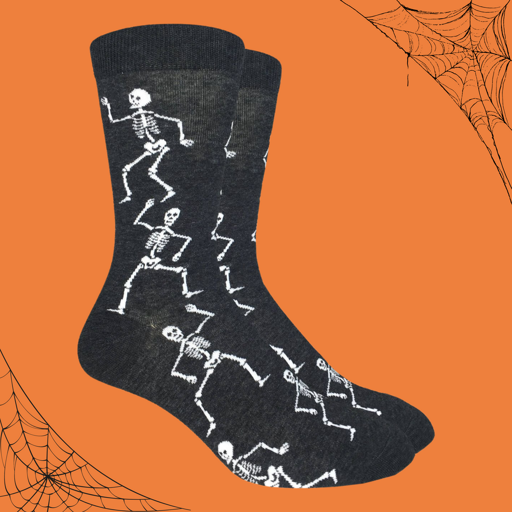 
                      
                        A pair of socks depicting dancing skeletons. Black leg, cuff, heel and toe. 
                      
                    