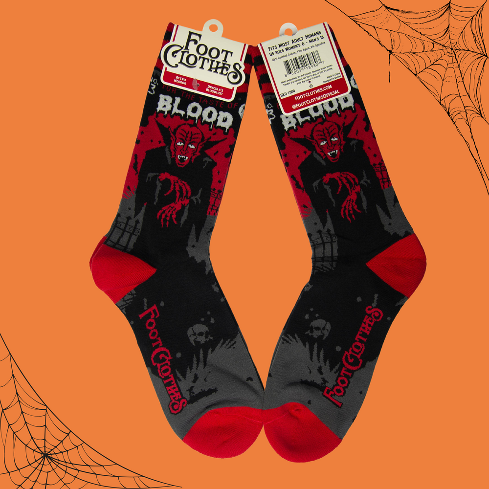 
                      
                        A pair of socks depicting Dracula and a vampire slogan. Red cuff, heel and toe.
                      
                    