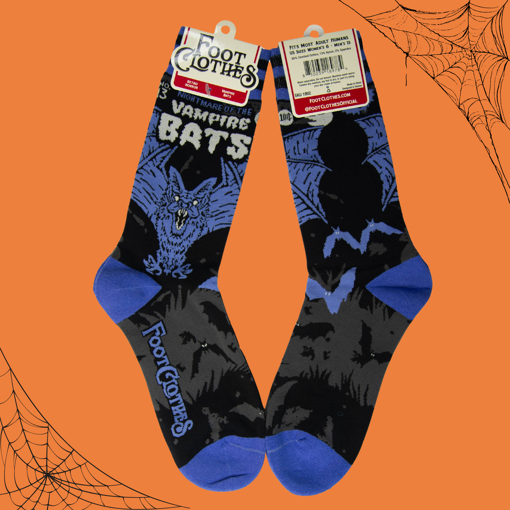 
                      
                        A pair of socks depicting a scary looking vampire bat. Blue toes, cuff and heel. 
                      
                    