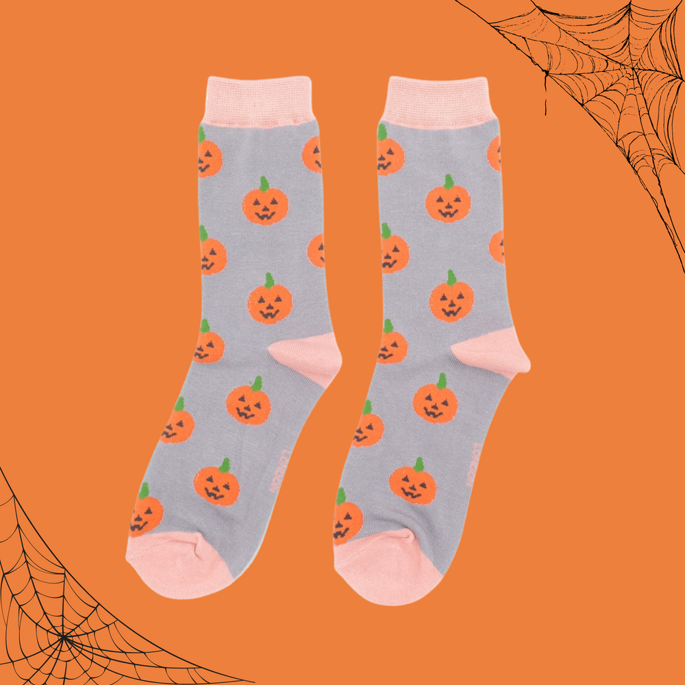 
                      
                        A pair of socks with a happy halloween pumpkin motif. 
                      
                    