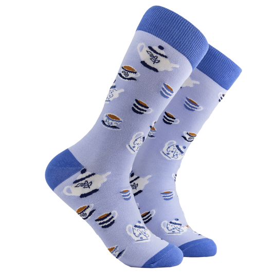 Tea Socks - Time for Tea 2. A pair of socks depicting tea cups and tea pots. Light blue legs, blue cuff, heel and toe.