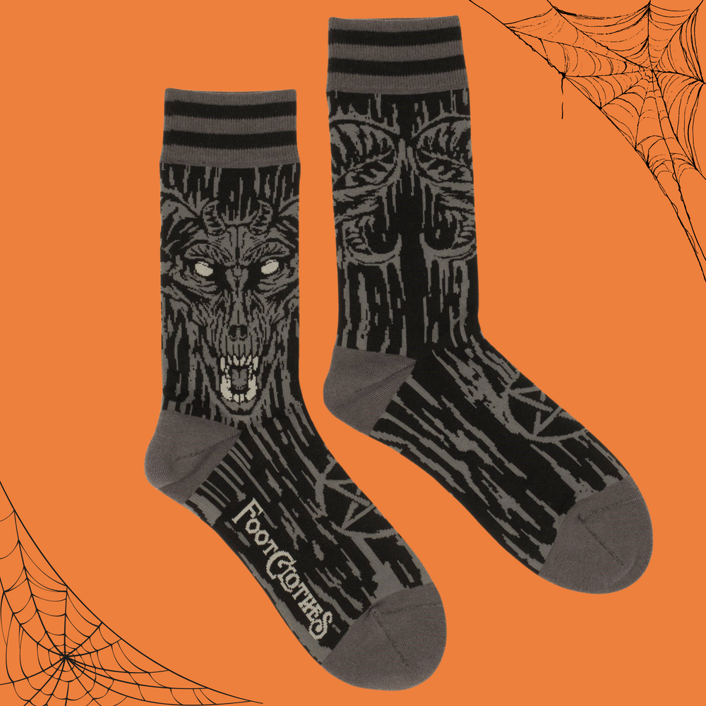 A pair of socks depicting a gruesome demon from the deep. Brown toes, heel and cuff. 