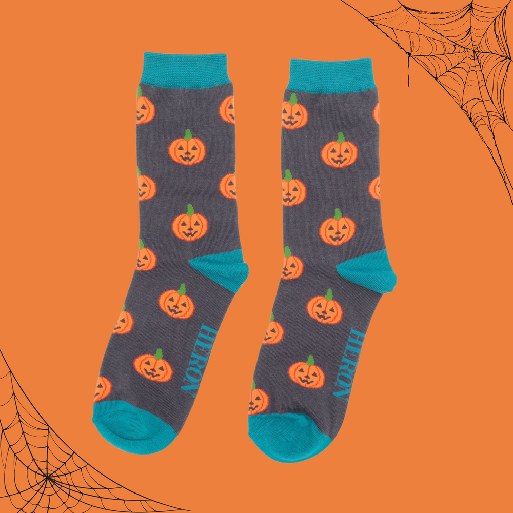 
                      
                        A pair of socks with a happy halloween pumpkin motif. 
                      
                    