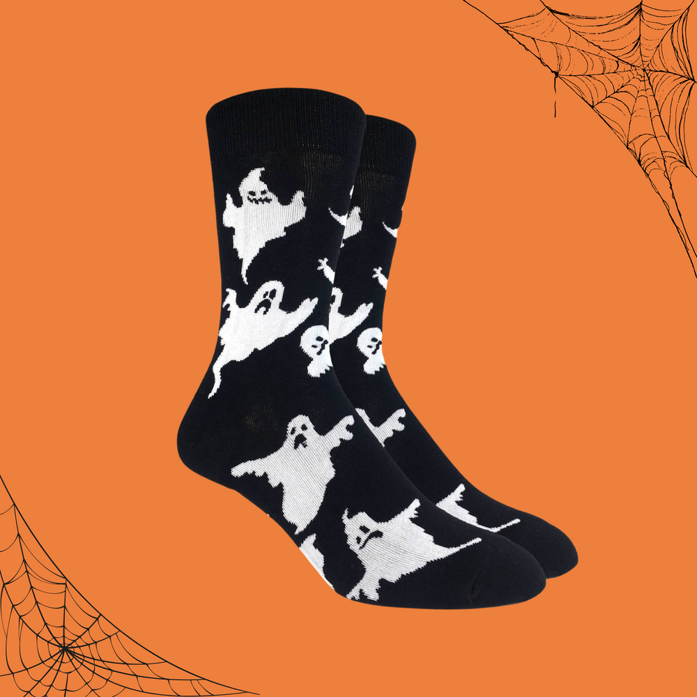 
                      
                        A pair of socks depicting classic bed sheet ghosts on a black background. 
                      
                    