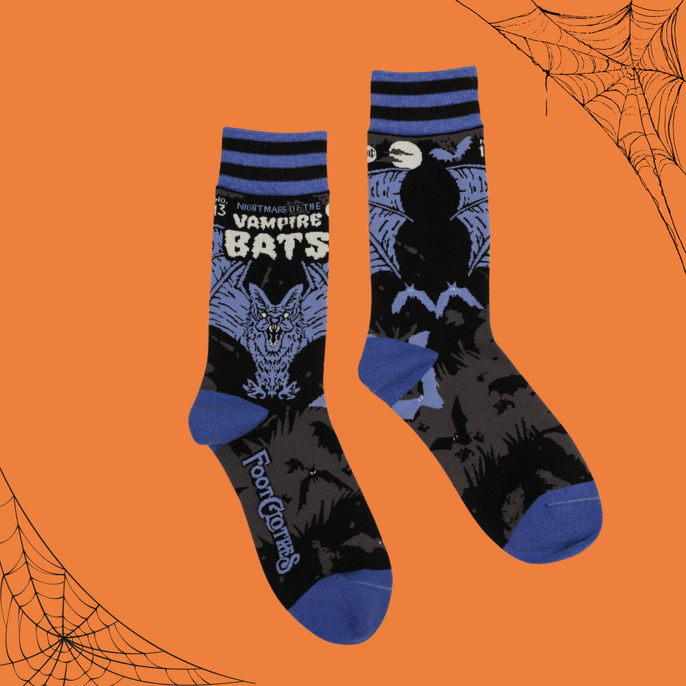 A pair of socks depicting a scary looking vampire bat. Blue toes, cuff and heel. 