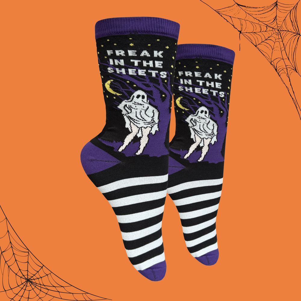 A pair of socks depicting a woman is classic ghost sheet costume. Black and white stripes, purple toe, cuff and heel.