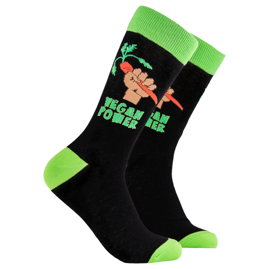 Vegan Socks - Vegan Power. A pair of socks depicting a fist holding a carrot and the phrase 'Vegan Power'. Black legs, bright green cuff, heel and toe.