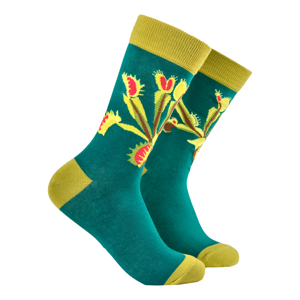 Venus Fly Trap Bamboo Socks. A pair of socks featuring a venus fly trap. Teal legs, yellow heel, toe and cuff. 