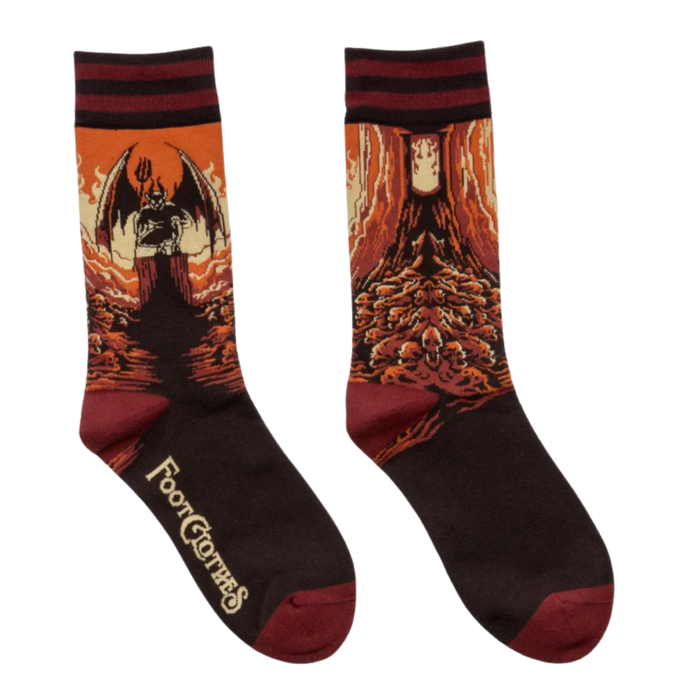 
                      
                        Heresy Crew Socks. A pair of socks featuring a devil on a pile of skulls. Brown legs, red heel, toe and cuff. 
                      
                    