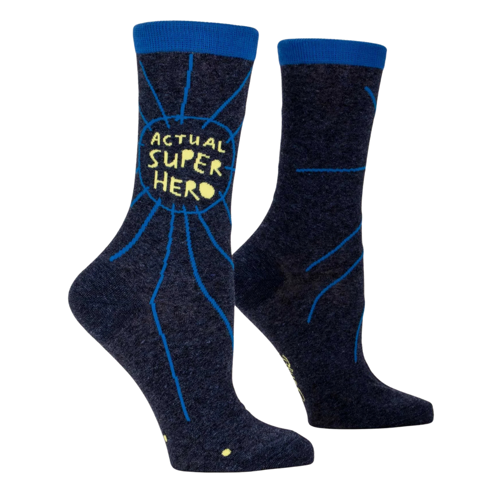 Actual Superhero Socks. A pair of socks with a superhero slogan. Dark blue legs, yellow text. 