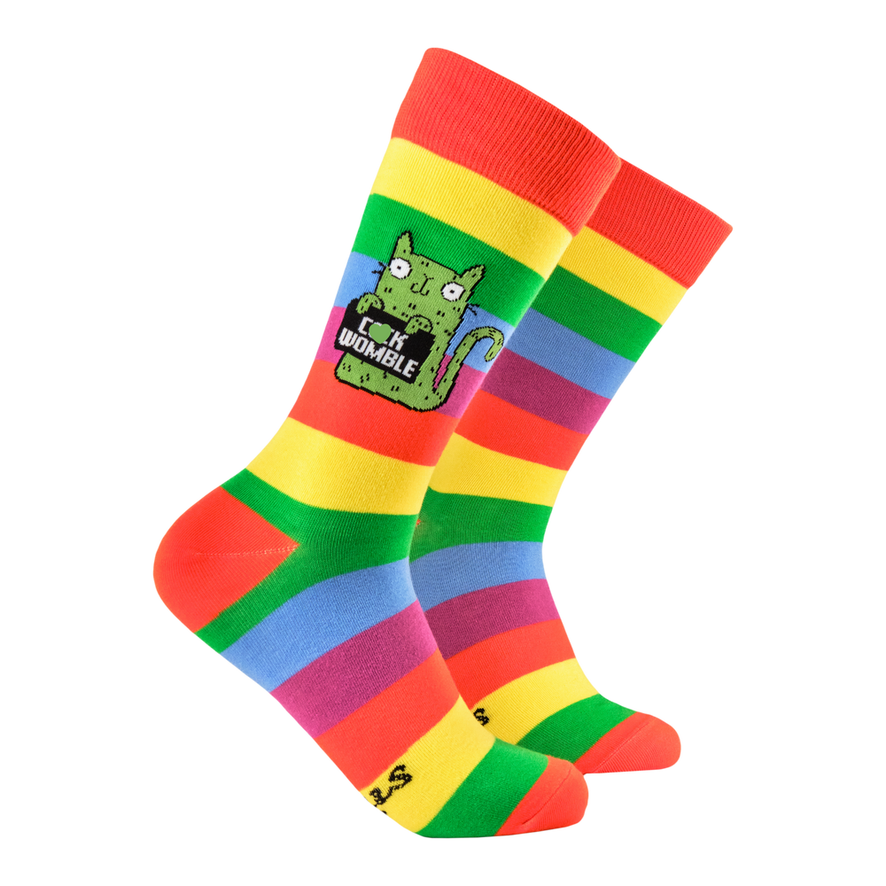 Cock Womble Socks - Soctopus X Katie Abey. A pair of socks featuring a cute cat holding a sweary sign. Rainbow striped legs. 