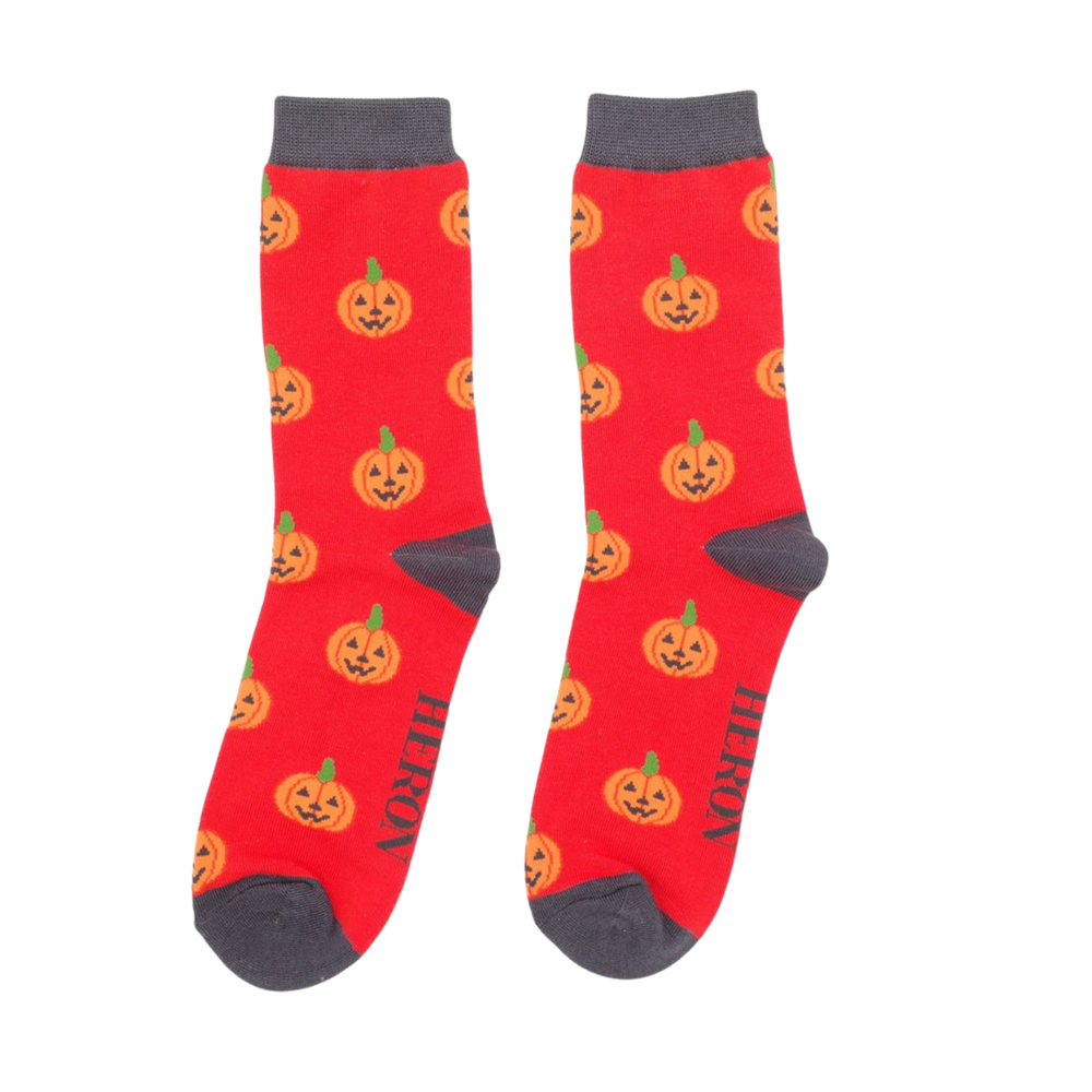 
                      
                        A pair of socks with a happy halloween pumpkin motif. 
                      
                    