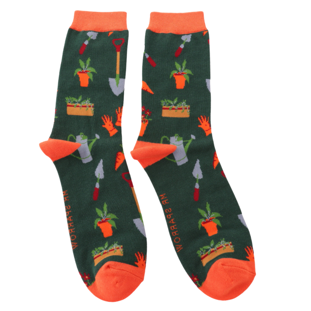 
                      
                        Gardener's Tools Bamboo Socks. A pair of socks featuring gardeners tools, dark green legs, orange heel, toe and cuff. 
                      
                    