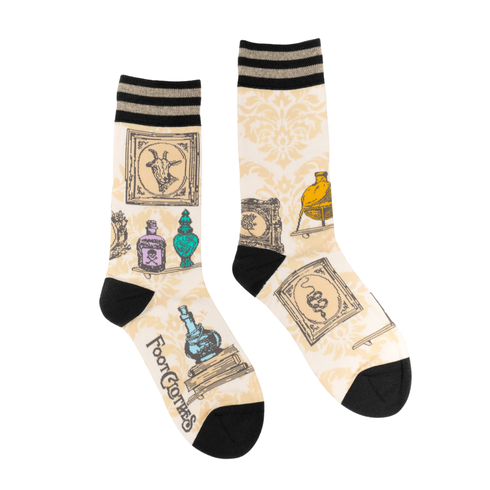 
                      
                        Toxic Curiosities Socks. A pair of socks featuring antique curiosities. Cream legs, black heel, toe and cuff. 
                      
                    