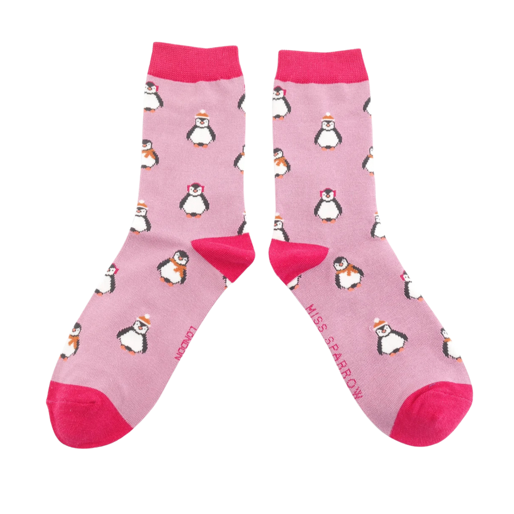 Christmas Baby Penguins Bamboo Socks - Miss Sparrow. A pair of socks depicting penguins wearing hats and scarves for the winter. Pink legs, bright pink toes, heels and cuffs. 