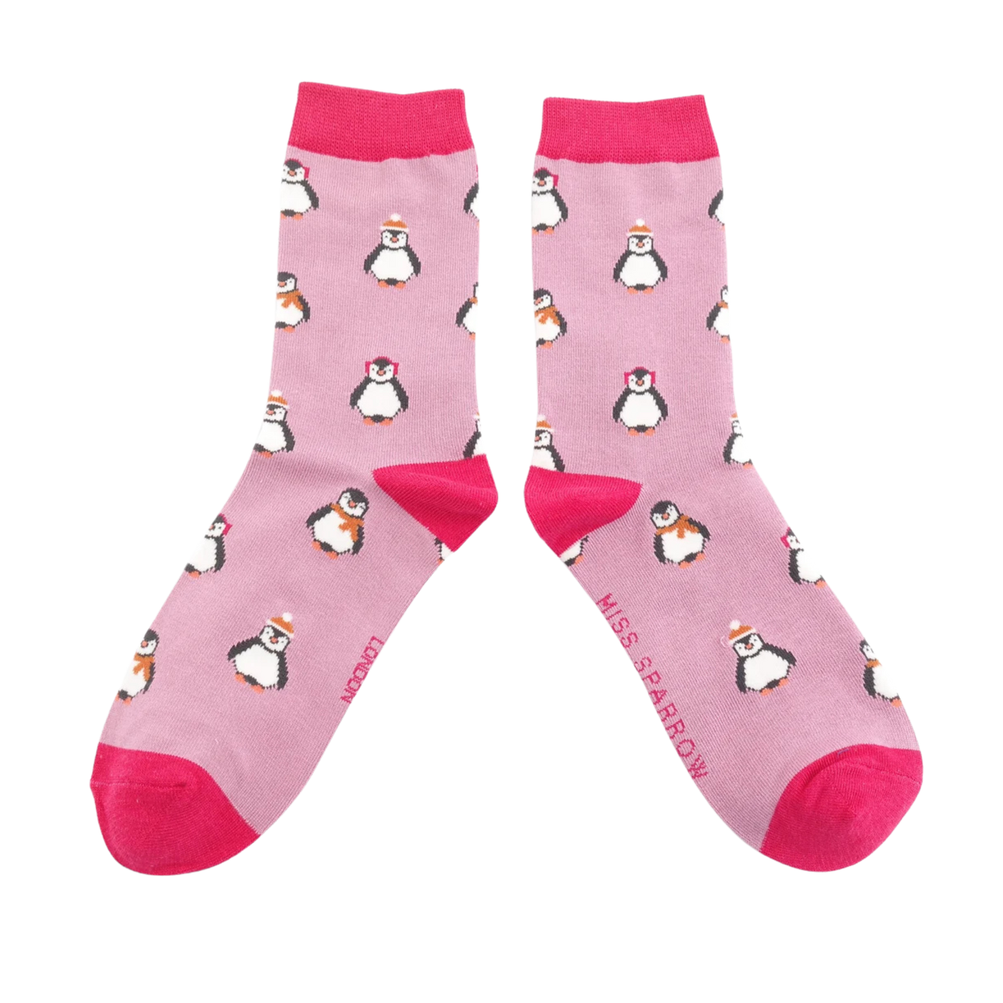 Christmas Baby Penguins Bamboo Socks - Miss Sparrow. A pair of socks depicting penguins wearing hats and scarves for the winter. Pink legs, bright pink toes, heels and cuffs. 