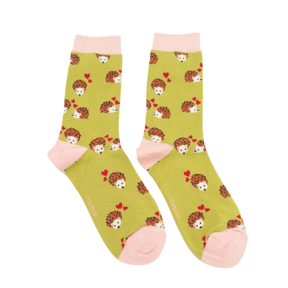 
                      
                        A pair of socks with a hedgehog and hearts motif. Yellow legs, pink heel, toe and cuff. 
                      
                    