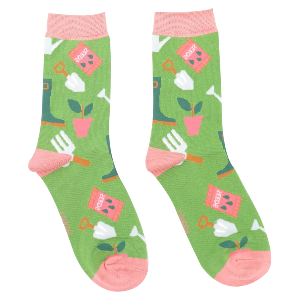 Gardening Gear Bamboo Socks. A pair of socks featuring gardening tools. Green legs, pink heel, toe and cuff. 