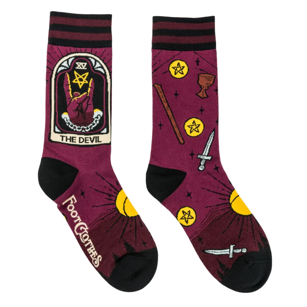 
                      
                        The Devil Tarot Nouveau Crew Socks. A pair of socks featuring the Devil tarot card. Deep red legs, black heel, toe and cuff. 
                      
                    