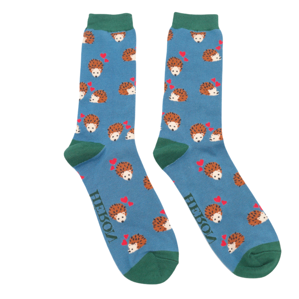 
                      
                        A pair of socks with a hedgehog and hearts motif. Blue legs, green heel, toe and cuff. 
                      
                    