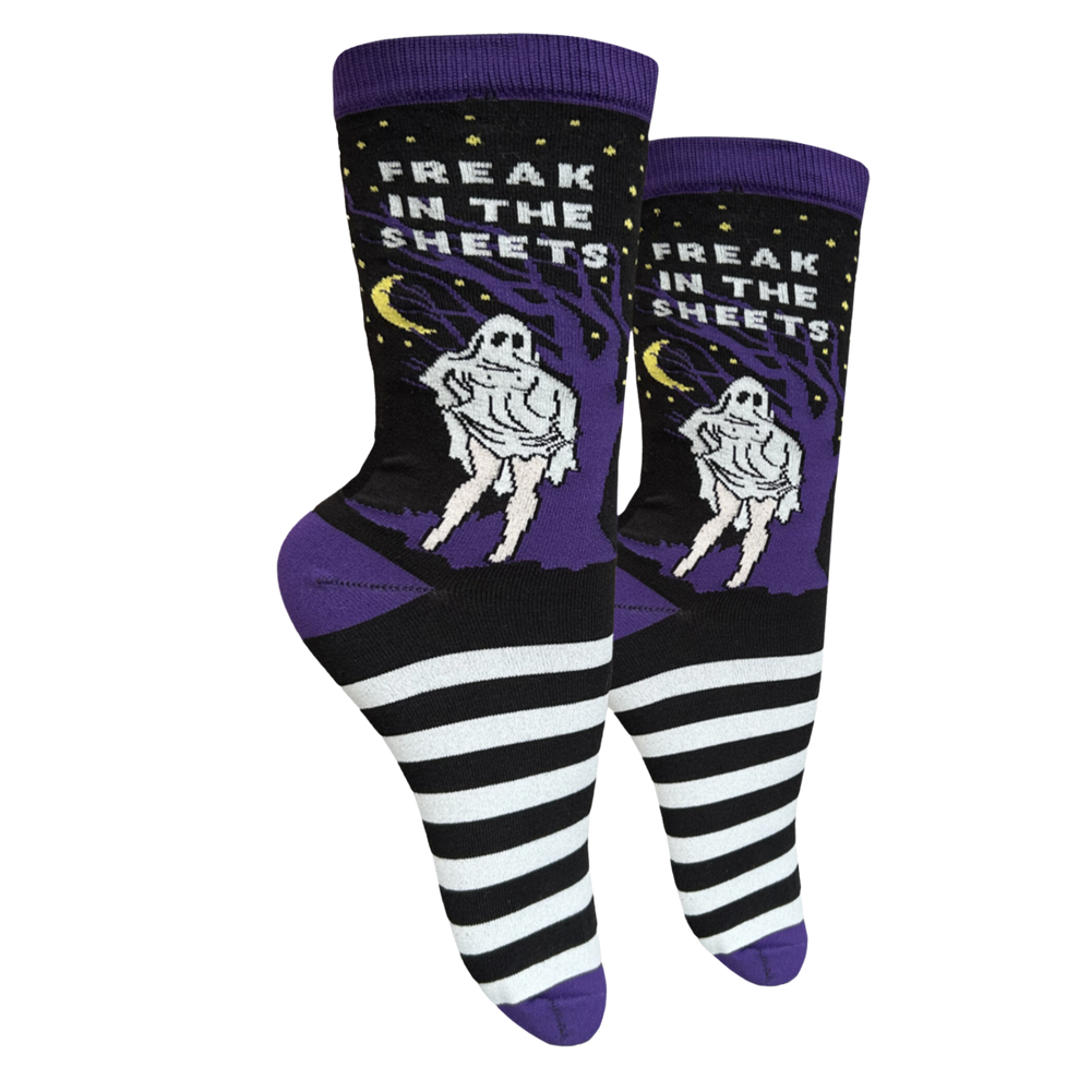 Freak In The Sheets Socks - Small. A pair of socks depicting a woman is classic ghost sheet costume. Black and white stripes, purple toe, cuff and heel. 