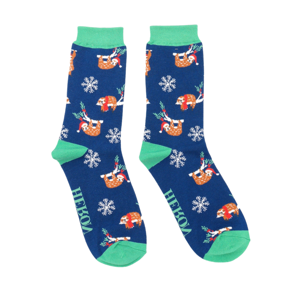 
                      
                        A pair of socks depicting xmas sloths wearing santa hats. Blue legs, green heel, toe and cuff. 
                      
                    