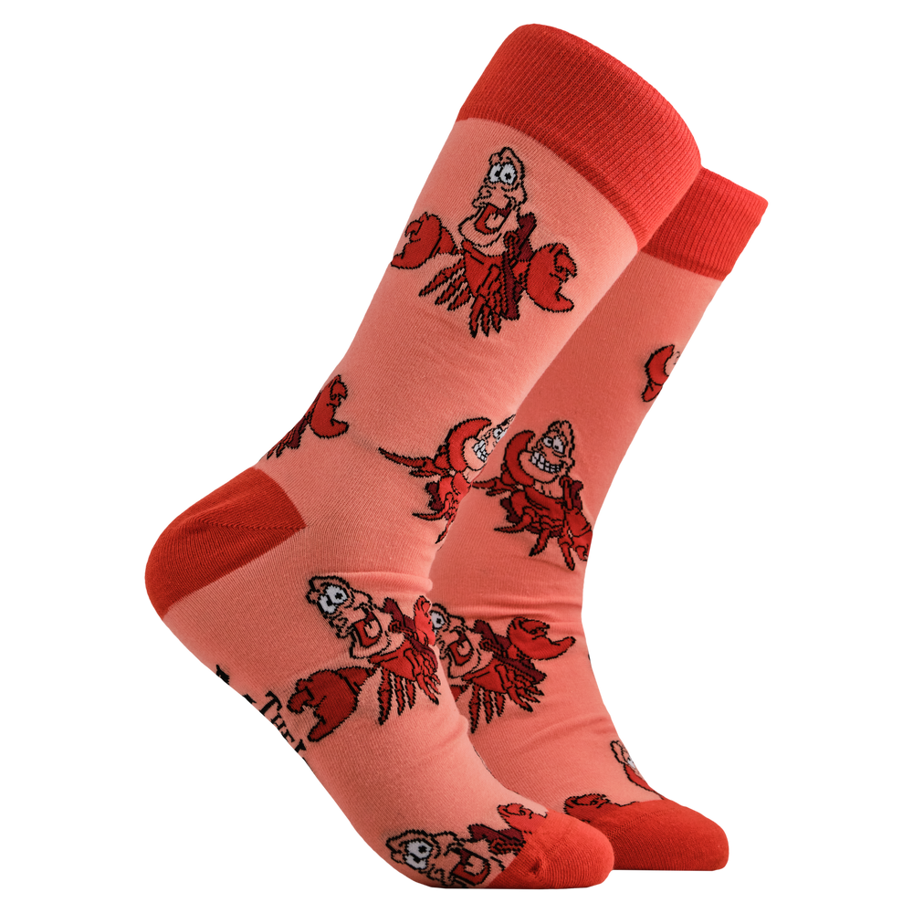 
                      
                        Disney's The Little Mermaid Socks - Sebastian. A pair of socks depicting Sebastian from The Little Mermaid. Coral legs, orange cuff, toe and heel. 
                      
                    