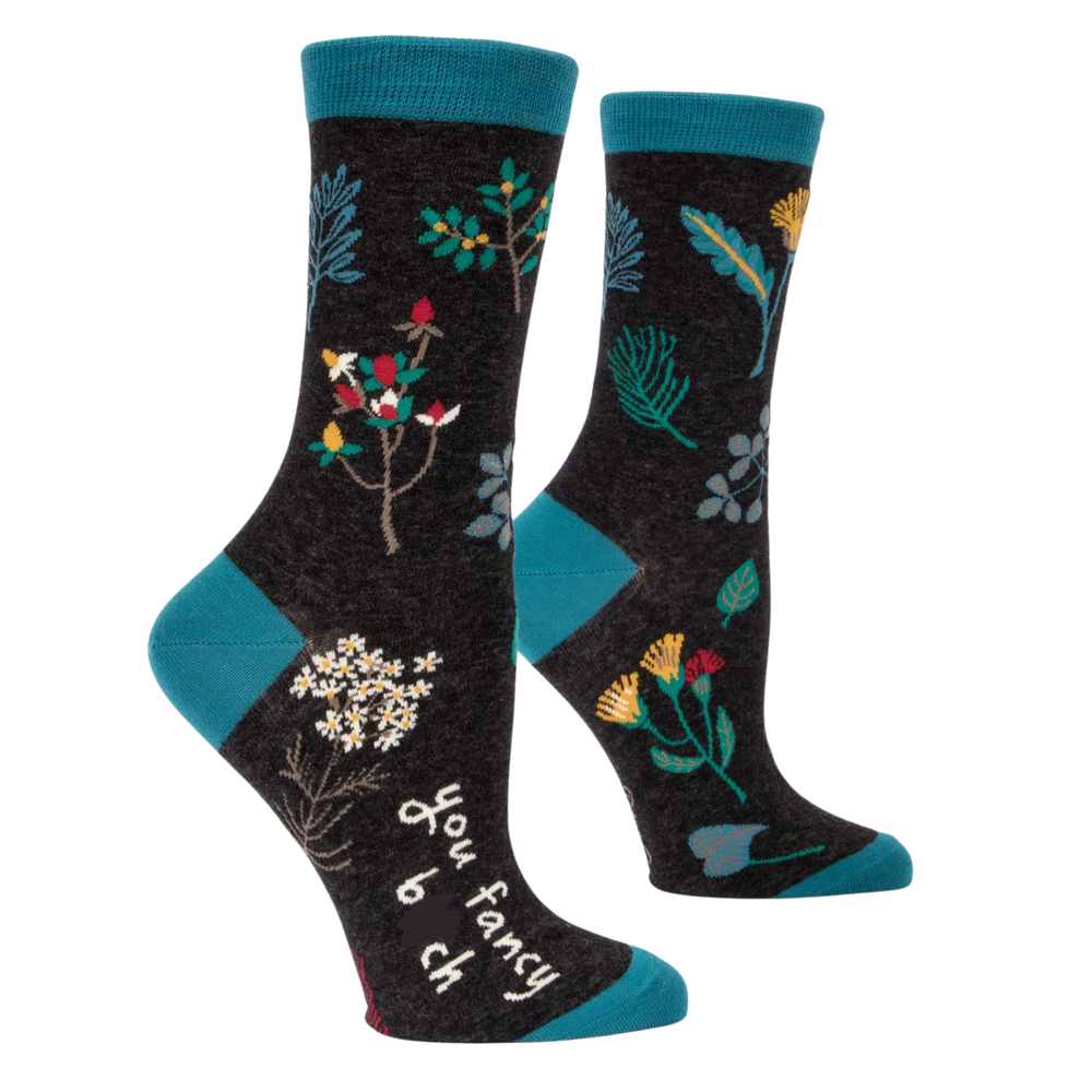 You Fancy B**ch Socks. A pair of socks with a floral motif. Black legs, blue heel, toe and cuff. 