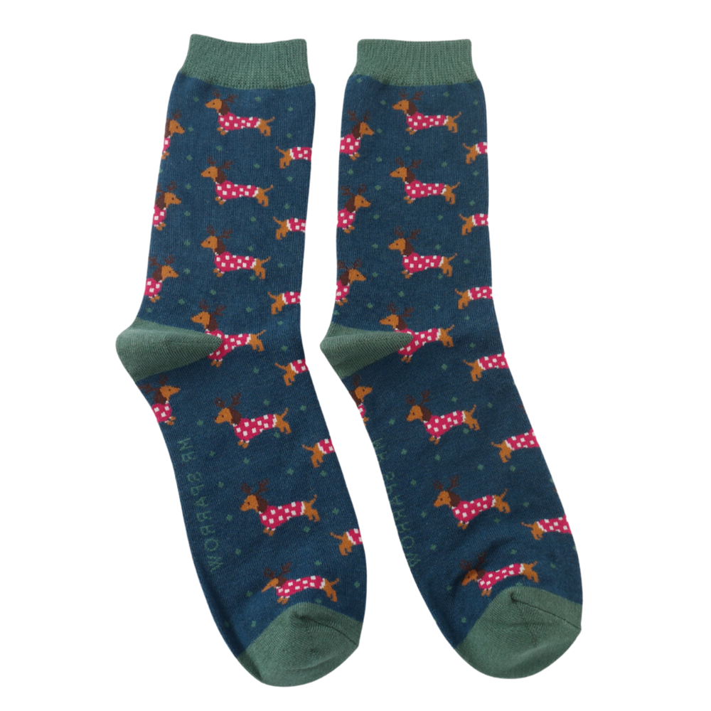 Xmas Sausage Dogs Bamboo Socks - Miss Sparrow. A pair of socks with a festive sausage dog pattern. Dark blue legs, dark green heel, toe and cuff. 